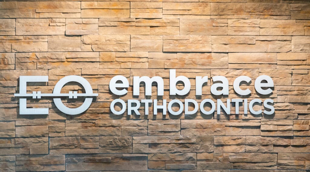 Logo wall Embrace Orthodontics Cibolo, TX
